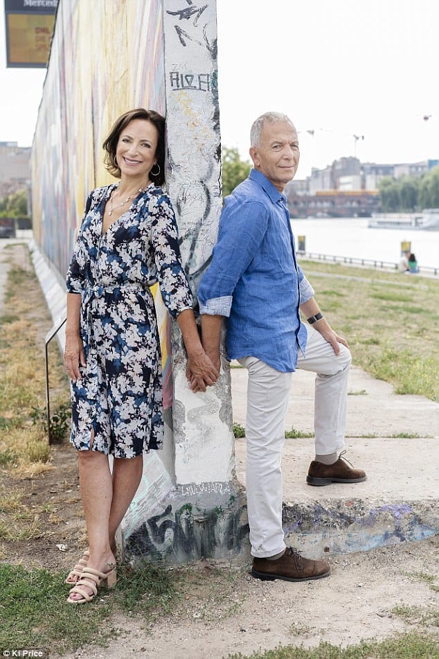 Linda Kelsey and her husband stood by the Berlin Wall - Couples Therapy in Berlin by Andrew G. Marshall
