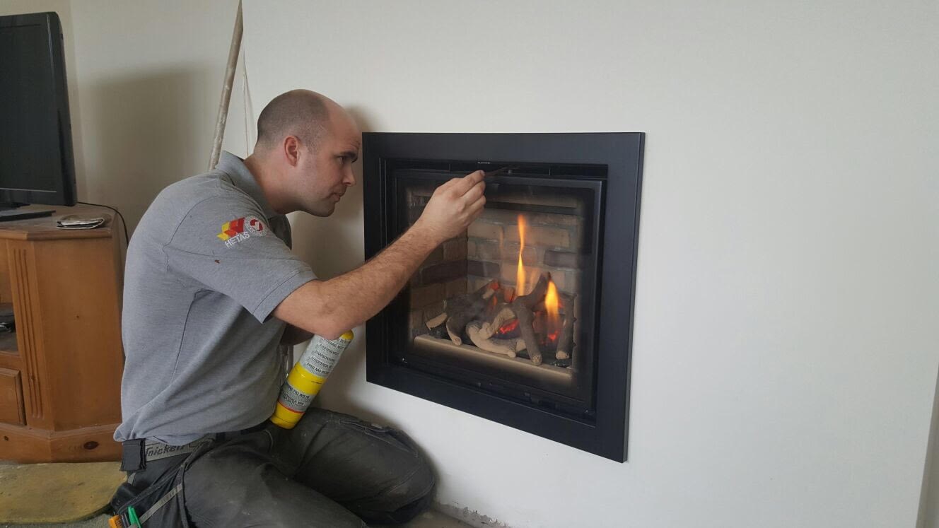 Carrying out the first spillage test, with doors shut and extractor fans on.